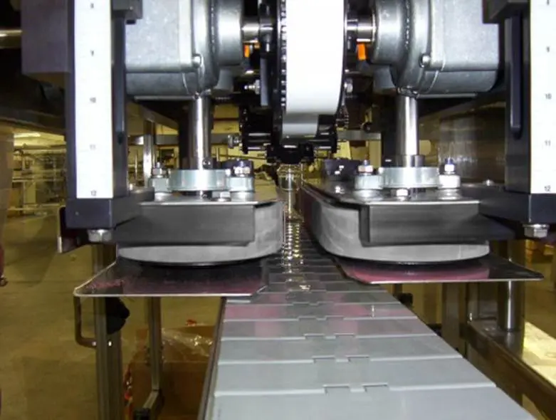 capper belt glass jars on capping machine belt