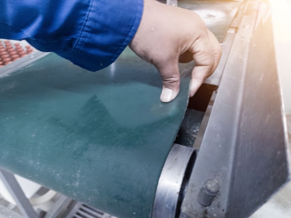 Inspection condition of belt conveyor on the manchinery. Tension check of belt conveyor co